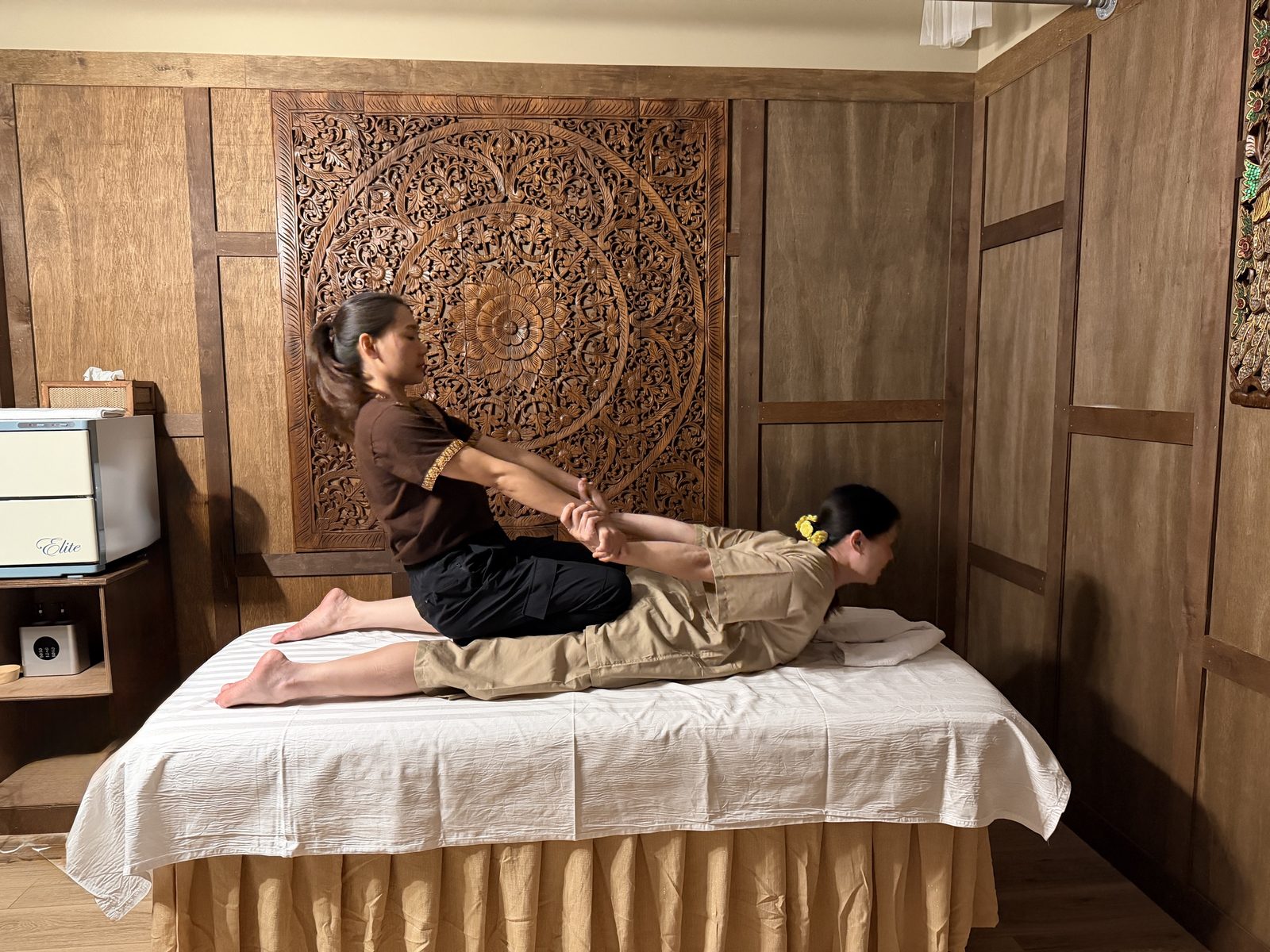 Therapist performing an assisted back stretch